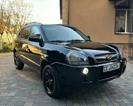 Черный Хендай Туксон, объемом двигателя 1.98 л и пробегом 198 тыс. км за 8250 $, фото 6 на Automoto.ua