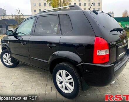 Черный Хендай Туксон, объемом двигателя 2 л и пробегом 168 тыс. км за 7700 $, фото 5 на Automoto.ua
