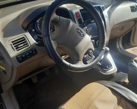 Черный Хендай Туксон, объемом двигателя 1.98 л и пробегом 176 тыс. км за 8200 $, фото 4 на Automoto.ua