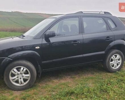 Черный Хендай Туксон, объемом двигателя 2 л и пробегом 198 тыс. км за 8200 $, фото 11 на Automoto.ua