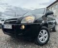 Черный Хендай Туксон, объемом двигателя 2 л и пробегом 166 тыс. км за 7500 $, фото 1 на Automoto.ua