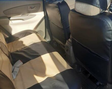 Черный Хендай Туксон, объемом двигателя 1.98 л и пробегом 176 тыс. км за 8200 $, фото 12 на Automoto.ua