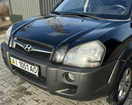 Черный Хендай Туксон, объемом двигателя 1.98 л и пробегом 220 тыс. км за 7500 $, фото 5 на Automoto.ua