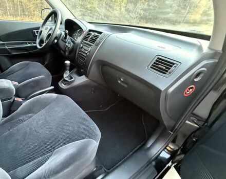 Черный Хендай Туксон, объемом двигателя 2 л и пробегом 148 тыс. км за 8700 $, фото 24 на Automoto.ua