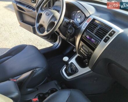 Черный Хендай Туксон, объемом двигателя 1.99 л и пробегом 159 тыс. км за 9700 $, фото 14 на Automoto.ua