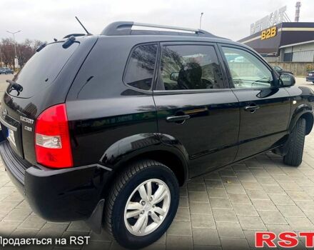 Черный Хендай Туксон, объемом двигателя 2 л и пробегом 168 тыс. км за 7700 $, фото 4 на Automoto.ua