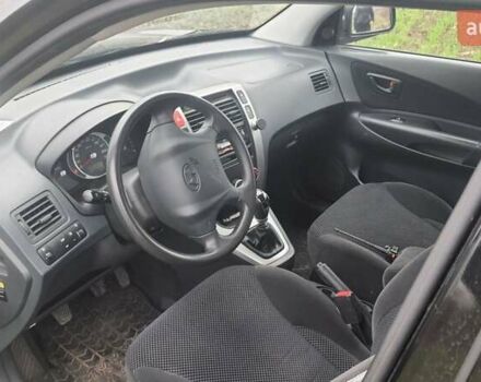 Черный Хендай Туксон, объемом двигателя 2 л и пробегом 198 тыс. км за 8200 $, фото 7 на Automoto.ua