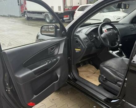 Черный Хендай Туксон, объемом двигателя 2 л и пробегом 237 тыс. км за 8350 $, фото 25 на Automoto.ua