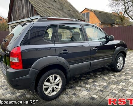 Чорний Хендай Туксон, об'ємом двигуна 2 л та пробігом 200 тис. км за 8499 $, фото 3 на Automoto.ua