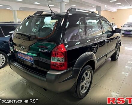 Черный Хендай Туксон, объемом двигателя 2 л и пробегом 160 тыс. км за 8800 $, фото 4 на Automoto.ua