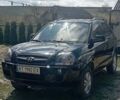 Черный Хендай Туксон, объемом двигателя 2 л и пробегом 182 тыс. км за 8800 $, фото 1 на Automoto.ua