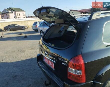 Черный Хендай Туксон, объемом двигателя 1.99 л и пробегом 159 тыс. км за 9700 $, фото 3 на Automoto.ua