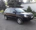 Черный Хендай Туксон, объемом двигателя 2 л и пробегом 220 тыс. км за 7500 $, фото 1 на Automoto.ua