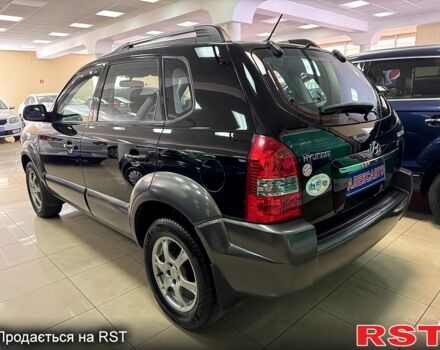 Черный Хендай Туксон, объемом двигателя 2 л и пробегом 160 тыс. км за 8800 $, фото 2 на Automoto.ua
