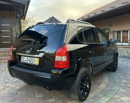 Черный Хендай Туксон, объемом двигателя 1.98 л и пробегом 198 тыс. км за 8250 $, фото 9 на Automoto.ua