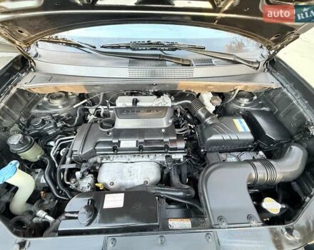 Черный Хендай Туксон, объемом двигателя 2 л и пробегом 148 тыс. км за 8700 $, фото 31 на Automoto.ua