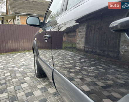 Чорний Хендай Туксон, об'ємом двигуна 2 л та пробігом 200 тис. км за 8450 $, фото 18 на Automoto.ua