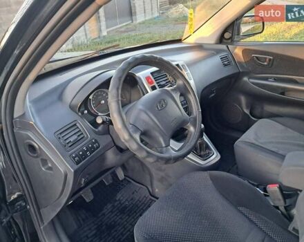 Черный Хендай Туксон, объемом двигателя 1.98 л и пробегом 233 тыс. км за 7850 $, фото 13 на Automoto.ua