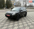 Черный Хендай Туксон, объемом двигателя 2 л и пробегом 191 тыс. км за 8500 $, фото 1 на Automoto.ua