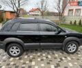 Черный Хендай Туксон, объемом двигателя 2.66 л и пробегом 205 тыс. км за 10000 $, фото 5 на Automoto.ua