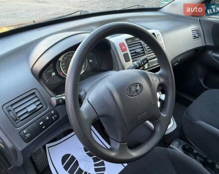 Черный Хендай Туксон, объемом двигателя 2 л и пробегом 110 тыс. км за 8899 $, фото 14 на Automoto.ua