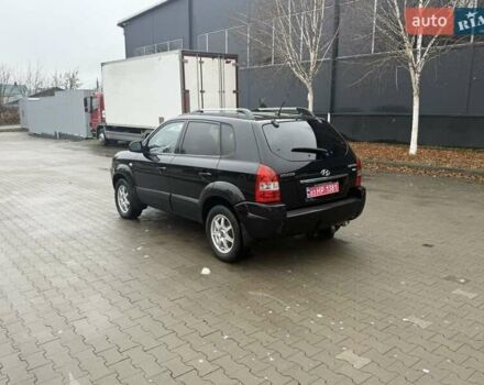 Черный Хендай Туксон, объемом двигателя 2 л и пробегом 237 тыс. км за 8350 $, фото 4 на Automoto.ua