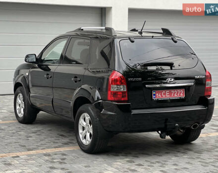 Чорний Хендай Туксон, об'ємом двигуна 2 л та пробігом 163 тис. км за 9199 $, фото 4 на Automoto.ua