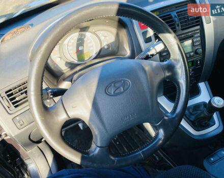 Черный Хендай Туксон, объемом двигателя 1.99 л и пробегом 95 тыс. км за 8500 $, фото 39 на Automoto.ua