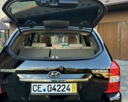 Черный Хендай Туксон, объемом двигателя 1.98 л и пробегом 198 тыс. км за 8250 $, фото 12 на Automoto.ua