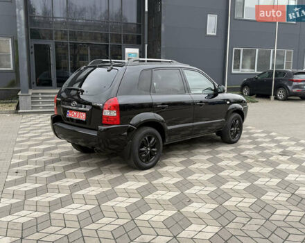 Черный Хендай Туксон, объемом двигателя 2 л и пробегом 191 тыс. км за 8500 $, фото 10 на Automoto.ua