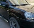Черный Хендай Туксон, объемом двигателя 2 л и пробегом 226 тыс. км за 8700 $, фото 2 на Automoto.ua