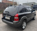 Черный Хендай Туксон, объемом двигателя 1.98 л и пробегом 120 тыс. км за 8500 $, фото 3 на Automoto.ua