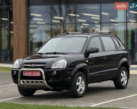 Черный Хендай Туксон, объемом двигателя 1.98 л и пробегом 202 тыс. км за 7650 $, фото 1 на Automoto.ua