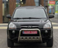 Черный Хендай Туксон, объемом двигателя 1.98 л и пробегом 202 тыс. км за 7650 $, фото 3 на Automoto.ua