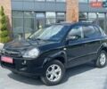Черный Хендай Туксон, объемом двигателя 2 л и пробегом 210 тыс. км за 9750 $, фото 1 на Automoto.ua