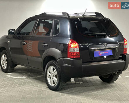 Черный Хендай Туксон, объемом двигателя 1.98 л и пробегом 129 тыс. км за 10600 $, фото 6 на Automoto.ua