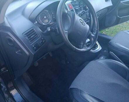 Черный Хендай Туксон, объемом двигателя 1.98 л и пробегом 298 тыс. км за 9300 $, фото 2 на Automoto.ua