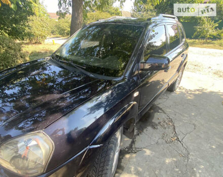 Черный Хендай Туксон, объемом двигателя 1.98 л и пробегом 245 тыс. км за 9000 $, фото 1 на Automoto.ua