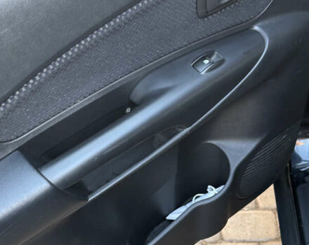 Черный Хендай Туксон, объемом двигателя 1.98 л и пробегом 218 тыс. км за 9350 $, фото 5 на Automoto.ua