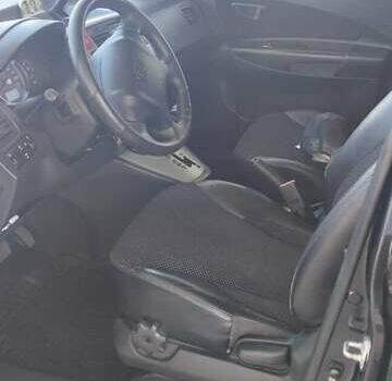 Черный Хендай Туксон, объемом двигателя 2 л и пробегом 141 тыс. км за 8500 $, фото 2 на Automoto.ua