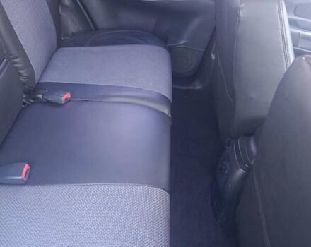 Черный Хендай Туксон, объемом двигателя 1.98 л и пробегом 298 тыс. км за 9300 $, фото 3 на Automoto.ua