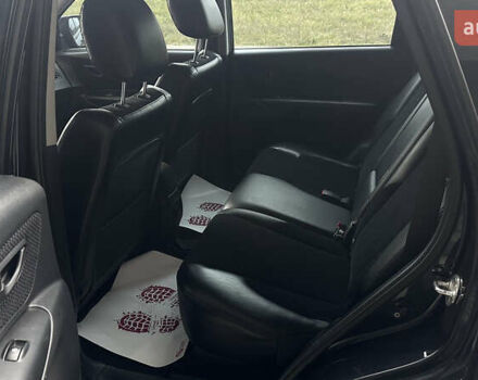 Черный Хендай Туксон, объемом двигателя 1.98 л и пробегом 129 тыс. км за 10600 $, фото 12 на Automoto.ua