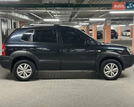 Черный Хендай Туксон, объемом двигателя 1.98 л и пробегом 129 тыс. км за 10600 $, фото 3 на Automoto.ua