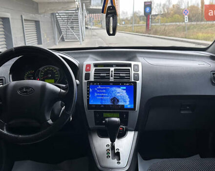 Черный Хендай Туксон, объемом двигателя 1.98 л и пробегом 129 тыс. км за 10600 $, фото 10 на Automoto.ua