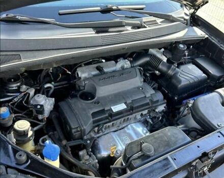 Черный Хендай Туксон, объемом двигателя 1.98 л и пробегом 186 тыс. км за 9500 $, фото 3 на Automoto.ua