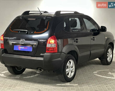 Черный Хендай Туксон, объемом двигателя 1.98 л и пробегом 129 тыс. км за 10600 $, фото 4 на Automoto.ua