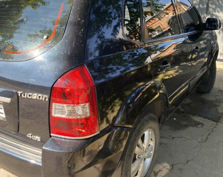 Черный Хендай Туксон, объемом двигателя 1.98 л и пробегом 245 тыс. км за 9000 $, фото 4 на Automoto.ua