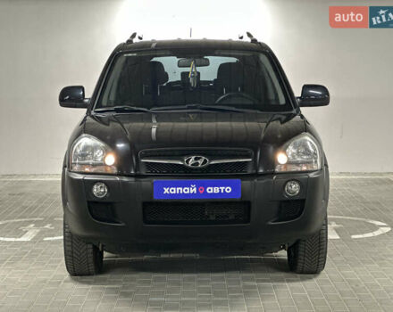 Черный Хендай Туксон, объемом двигателя 1.98 л и пробегом 129 тыс. км за 10600 $, фото 1 на Automoto.ua