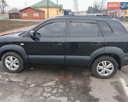 Черный Хендай Туксон, объемом двигателя 1.98 л и пробегом 214 тыс. км за 9100 $, фото 1 на Automoto.ua