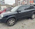 Черный Хендай Туксон, объемом двигателя 2 л и пробегом 175 тыс. км за 8000 $, фото 1 на Automoto.ua